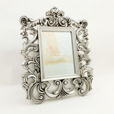 silver ornate mirror