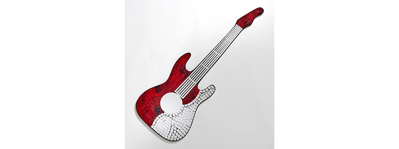 silver and red mosaic guitar 